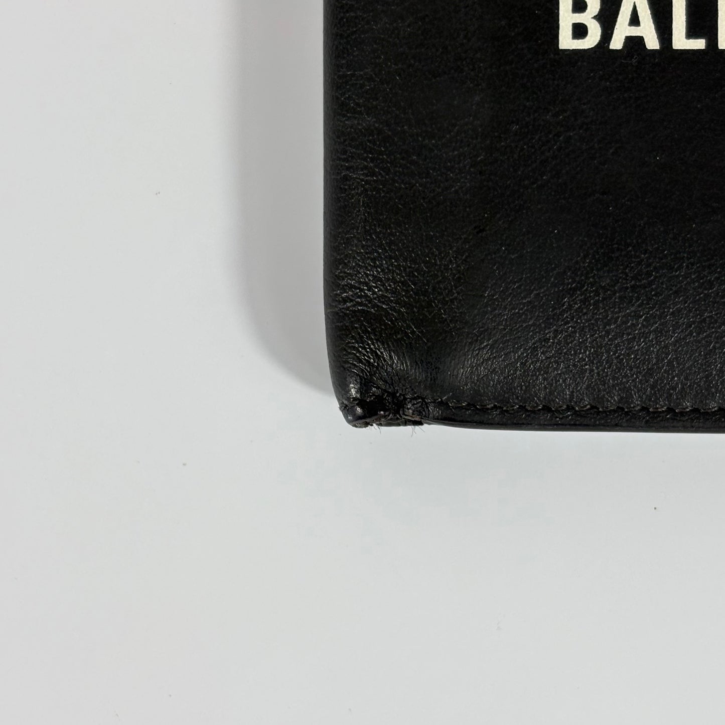Balenciaga Cash Square in pelle di vitello nera e logo bianco