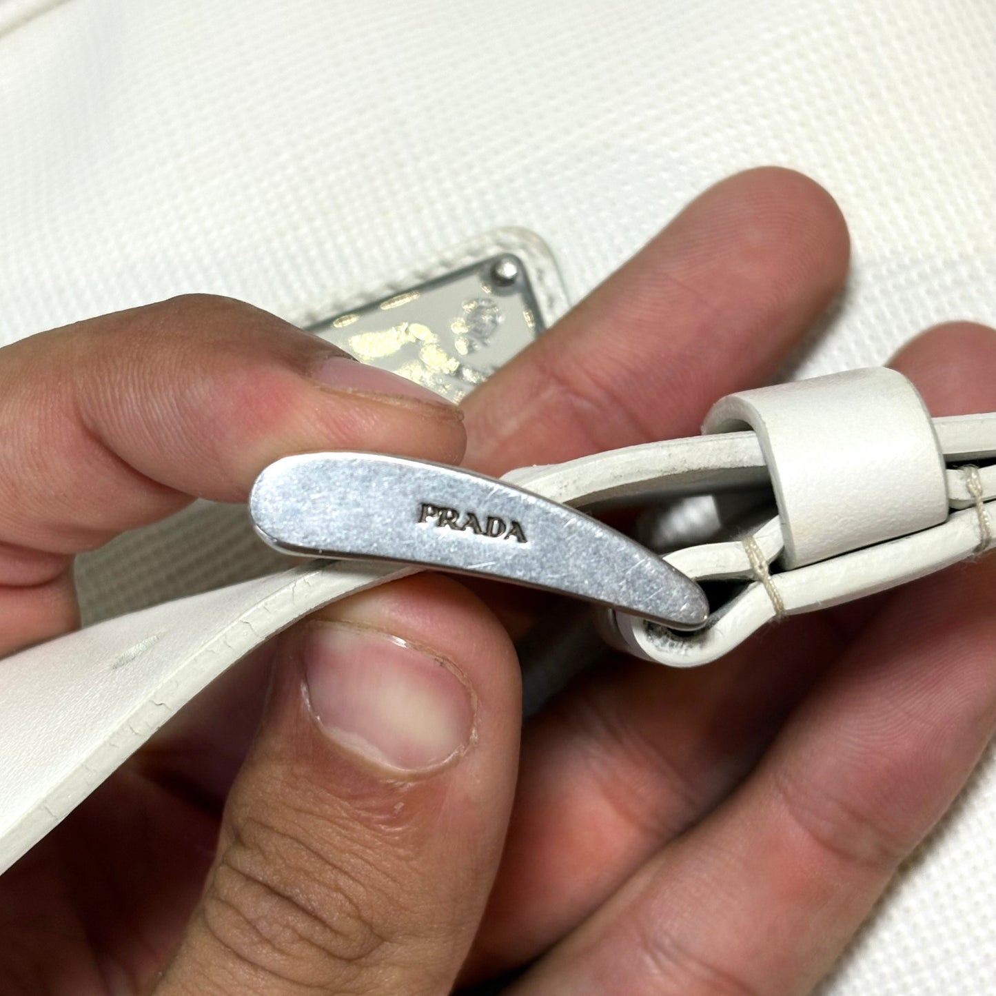 Prada Triangle in pelle bianco