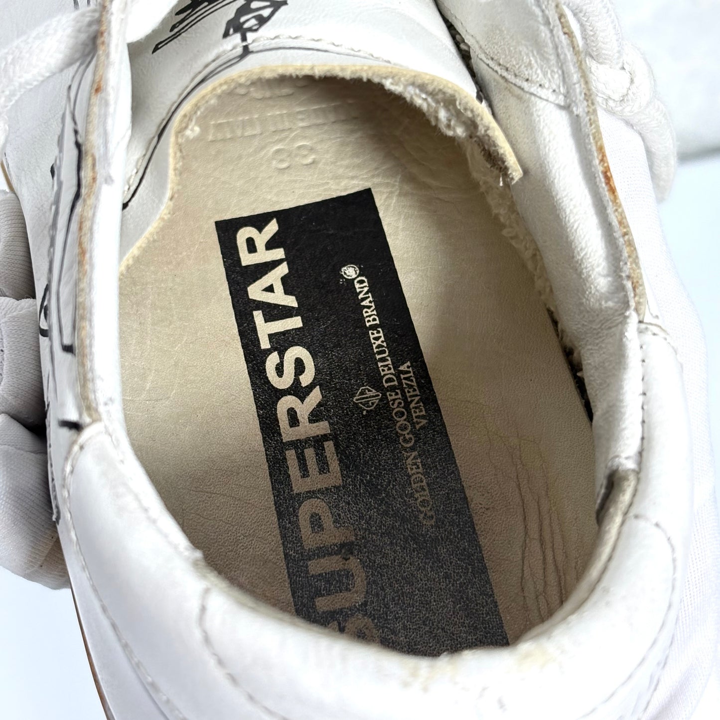 Golden goose Superstar bianche con disegni stilizzati 38