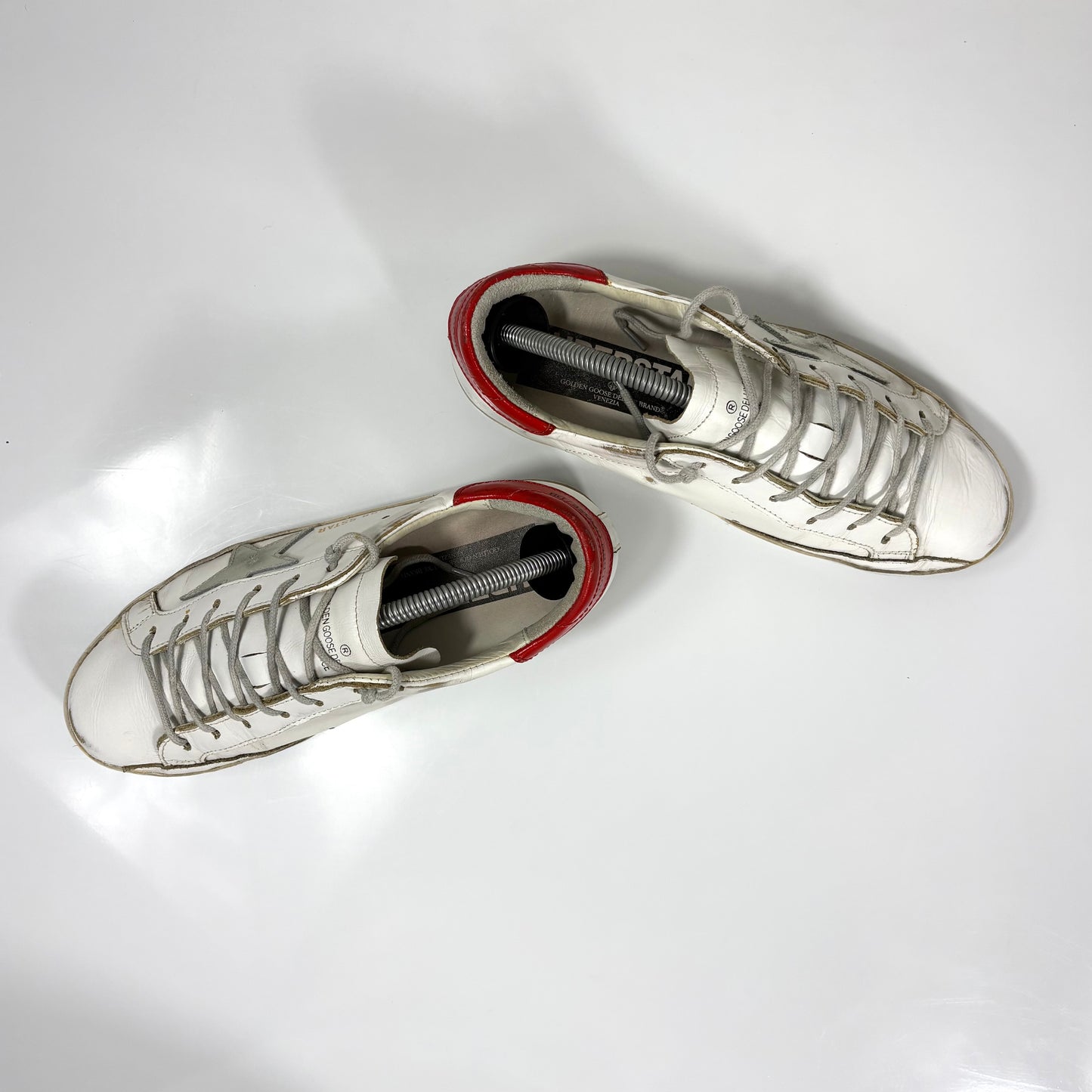 Golden goose Superstar bianche con stella argento e talloncino rosso 37