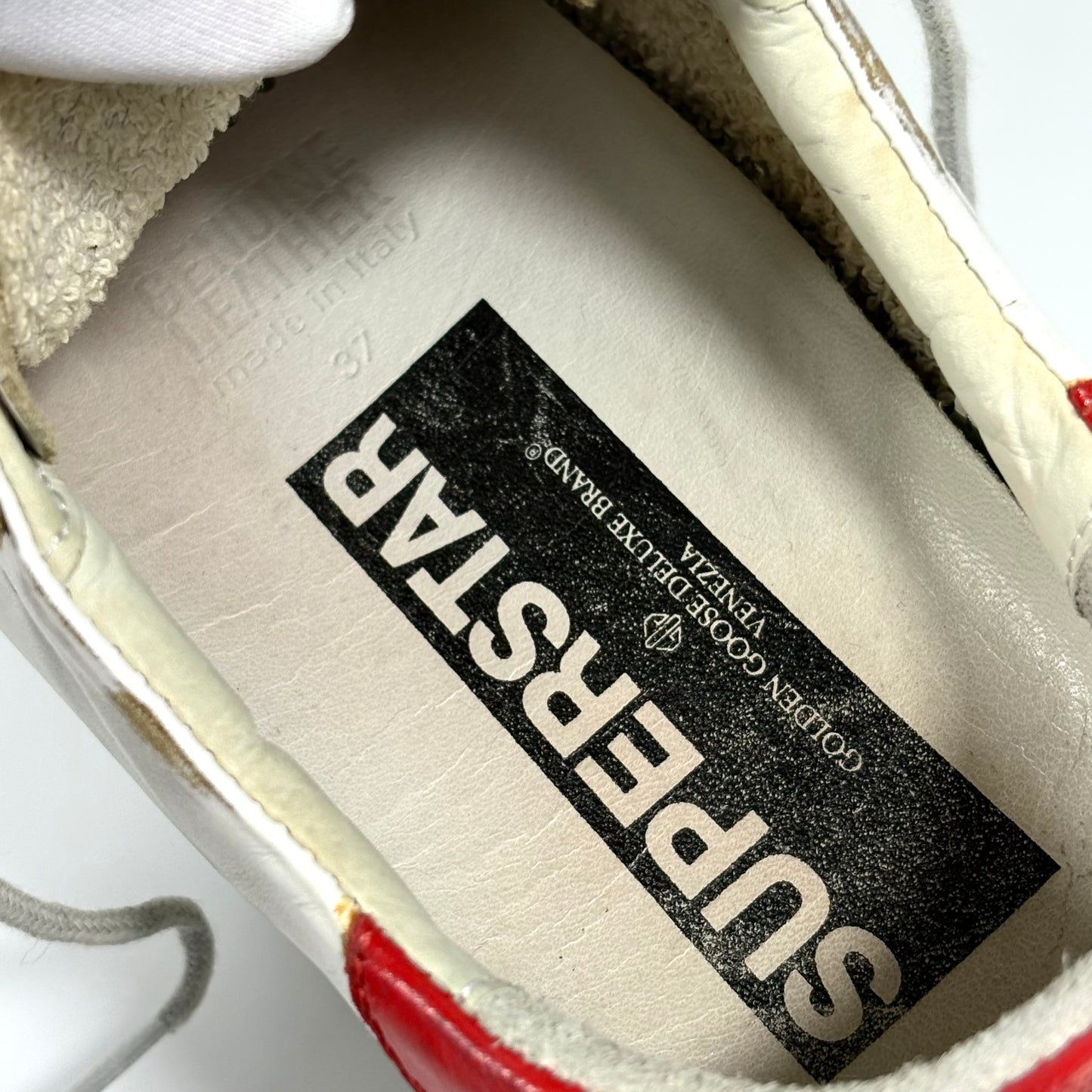 Golden goose Superstar bianche con stella argento e talloncino rosso 37
